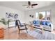 Inviting living room with a modern sofa, hardwood floors, and bright, neutral colors at 1681 Nome St, Aurora, CO 80010