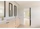 Stylish bathroom offers a double vanity with sleek fixtures and direct access to a bright bedroom at 4322 Quivas St, Denver, CO 80211