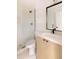 Modern bathroom features sleek vanity, framed mirror and glass enclosed shower at 4322 Quivas St, Denver, CO 80211