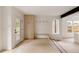 Clean entryway with built-in storage, bench, and minimalist design for a welcoming entrance at 4322 Quivas St, Denver, CO 80211