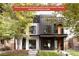Stunning modern home exterior with unique architectural details and lush landscaping at 4322 Quivas St, Denver, CO 80211