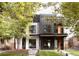 Stunning modern home exterior with unique architectural details and lush landscaping at 4322 Quivas St, Denver, CO 80211
