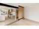 Open-concept living room view with modern kitchen, dining area, and sleek design at 4322 Quivas St, Denver, CO 80211