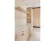 Well-organized mudroom featuring floating shelves, sleek cabinets, and a bright countertop space at 4322 Quivas St, Denver, CO 80211