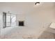 Cozy living room with a fireplace and sliding glass doors leading to the outside at 11103 E Alameda Ave # 102, Aurora, CO 80012