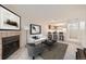 Inviting living room with a fireplace, modern furniture, and access to the kitchen at 11103 E Alameda Ave # 102, Aurora, CO 80012