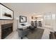 Cozy living room with fireplace and bar seating area leading to the kitchen, perfect for entertaining at 11103 E Alameda Ave # 102, Aurora, CO 80012