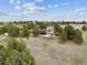 Expansive property showcasing a two-story home with lush trees and a serene landscape at 11035 E Parker Rd, Parker, CO 80138
