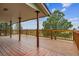 A beautiful wood deck showcases natural wood and provides a beautiful place to relax at 11035 E Parker Rd, Parker, CO 80138