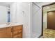 Bathroom featuring a vanity with marble countertops, a towel ring, and a walk-in shower at 11035 E Parker Rd, Parker, CO 80138