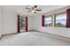 Spacious bedroom features plush carpet and double windows for ample natural light at 11035 E Parker Rd, Parker, CO 80138