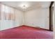 A simple bedroom features a modern light fixture and white walls at 11035 E Parker Rd, Parker, CO 80138