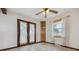 The dining area features tiled floors, double French doors and built-in corner cabinet at 11035 E Parker Rd, Parker, CO 80138