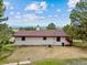 Aerial view of rear exterior showing expansive land lot and distant, panoramic views at 11035 E Parker Rd, Parker, CO 80138