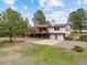 Charming two-story home with a large deck and two car garage in a lush, green setting at 11035 E Parker Rd, Parker, CO 80138