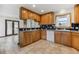 Open kitchen features light cabinetry, tiled backsplash, and views of the adjoining dining area at 11035 E Parker Rd, Parker, CO 80138