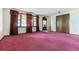 Bright living room features classic windows with heavy curtains and neutral walls at 11035 E Parker Rd, Parker, CO 80138