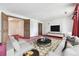 Cozy living room with modern entertainment center, bold design, and comfortable seating at 11035 E Parker Rd, Parker, CO 80138