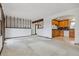 Spacious living room with carpet, connecting to the kitchen with wood cabinets at 11035 E Parker Rd, Parker, CO 80138