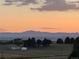 Beautiful sunset view of the mountains from this property at 11035 E Parker Rd, Parker, CO 80138