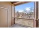 The exterior balcony showcases an apartment complex beyond bare trees at 1632 W Canal Cir # 924, Littleton, CO 80120