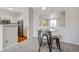 Dining area with glass table and seating next to the kitchen at 1632 W Canal Cir # 924, Littleton, CO 80120