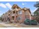 Attractive condo building with brick accents, multiple balconies, and landscaped surroundings at 1632 W Canal Cir # 924, Littleton, CO 80120