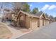 Row of garages that match apartment building with landscaping in front at 1632 W Canal Cir # 924, Littleton, CO 80120