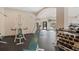 Community gym with weight machines, weights, and treadmill by large windows at 1632 W Canal Cir # 924, Littleton, CO 80120