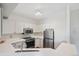 Bright kitchen with stainless steel appliances and white countertops at 1632 W Canal Cir # 924, Littleton, CO 80120