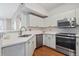 Bright kitchen featuring stainless steel appliances, plenty of counterspace and white cabinets at 1632 W Canal Cir # 924, Littleton, CO 80120