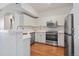 Modern kitchen featuring stainless steel appliances, white cabinets, and hardwood flooring at 1632 W Canal Cir # 924, Littleton, CO 80120