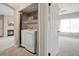 Laundry closet featuring a washer and dryer at 1632 W Canal Cir # 924, Littleton, CO 80120