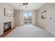 Spacious living room with fireplace, ceiling fan, and balcony access for relaxing at 1632 W Canal Cir # 924, Littleton, CO 80120