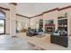 Inviting lounge featuring stylish sofas, a fireplace, and shelving, perfect for gatherings and relaxation at 1632 W Canal Cir # 924, Littleton, CO 80120