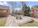 Outdoor picnic area with tables and a grill, perfect for enjoying meals outside near community amenities at 1632 W Canal Cir # 924, Littleton, CO 80120