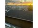 The sunset provides a gorgeous view of the mountains beyond the rooftop at 1632 W Canal Cir # 924, Littleton, CO 80120