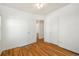 Empty bedroom features hardwood floors, white walls, and two closets, ready for personalization at 2570 Jay St, Edgewater, CO 80214