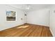 Empty living room with hardwood floors and ceiling fan at 2570 Jay St, Edgewater, CO 80214