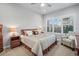 Inviting bedroom with ceiling fan, plush bedding, and shuttered windows allowing for plenty of natural light at 5506 Water Avens Dr, Castle Rock, CO 80104