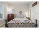 Inviting bedroom featuring a cozy bed, dresser, and a stylish quilt, creating a relaxing atmosphere at 5506 Water Avens Dr, Castle Rock, CO 80104