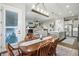 Open-concept dining area flows into the kitchen and living room, great for entertaining guests at 5506 Water Avens Dr, Castle Rock, CO 80104