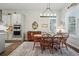 Charming dining room featuring a wooden table set and a vintage hutch with ample natural light at 5506 Water Avens Dr, Castle Rock, CO 80104