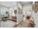 Beautiful home entry featuring hardwood floors, an adjacent office space, and an open concept design at 5506 Water Avens Dr, Castle Rock, CO 80104