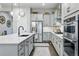 Open kitchen design featuring a central island, stainless steel appliances, and ample counter space at 5506 Water Avens Dr, Castle Rock, CO 80104