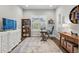 Bright home office space with a large window, wood floors, and comfortable furnishings at 5506 Water Avens Dr, Castle Rock, CO 80104