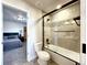 Bathroom with tub/shower combo and view of bedroom at 4525 Cholla Trl, Castle Rock, CO 80104