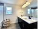 Modern bathroom with double vanity and large mirror at 4525 Cholla Trl, Castle Rock, CO 80104