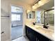 Bathroom with double vanity and view of bedroom at 4525 Cholla Trl, Castle Rock, CO 80104