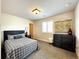 Cozy bedroom with a dresser and window at 4525 Cholla Trl, Castle Rock, CO 80104